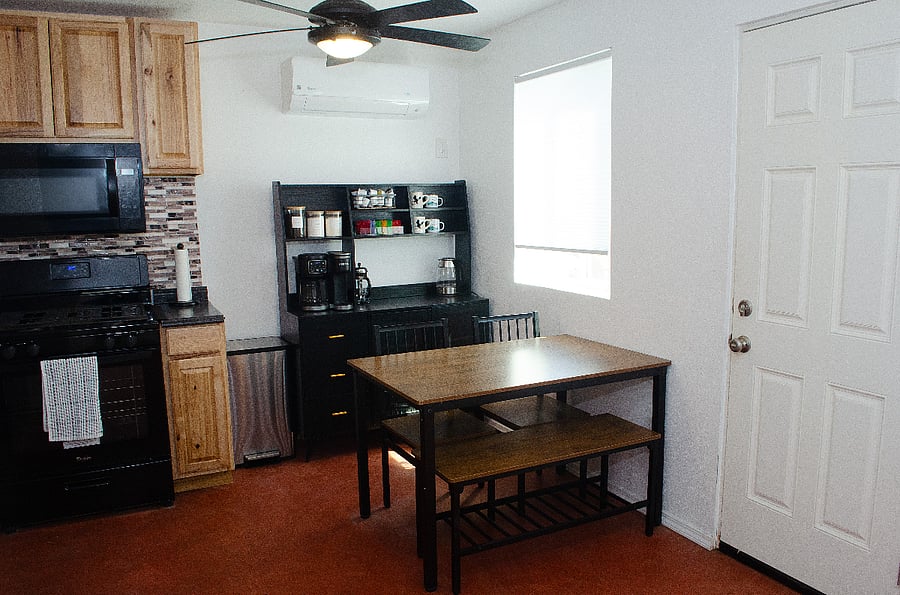 Full kitchen - stove, microwave, refrigerator, coffee maker and table
