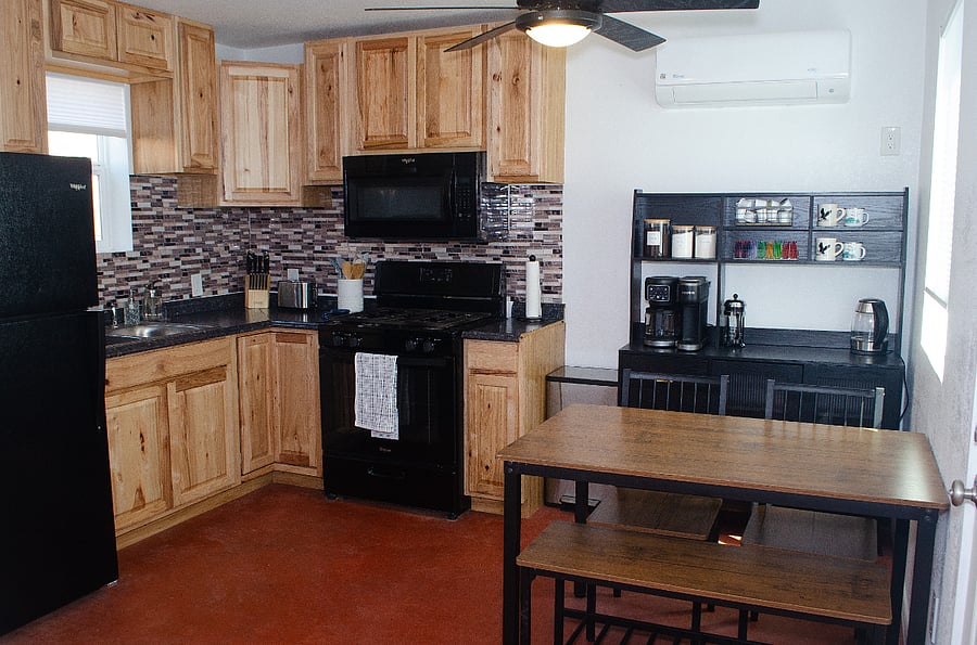 Full kitchen - stove, microwave, refrigerator, coffee maker and table