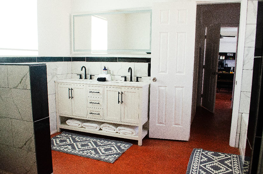 Downstairs full bath with double sinks and LED mirror