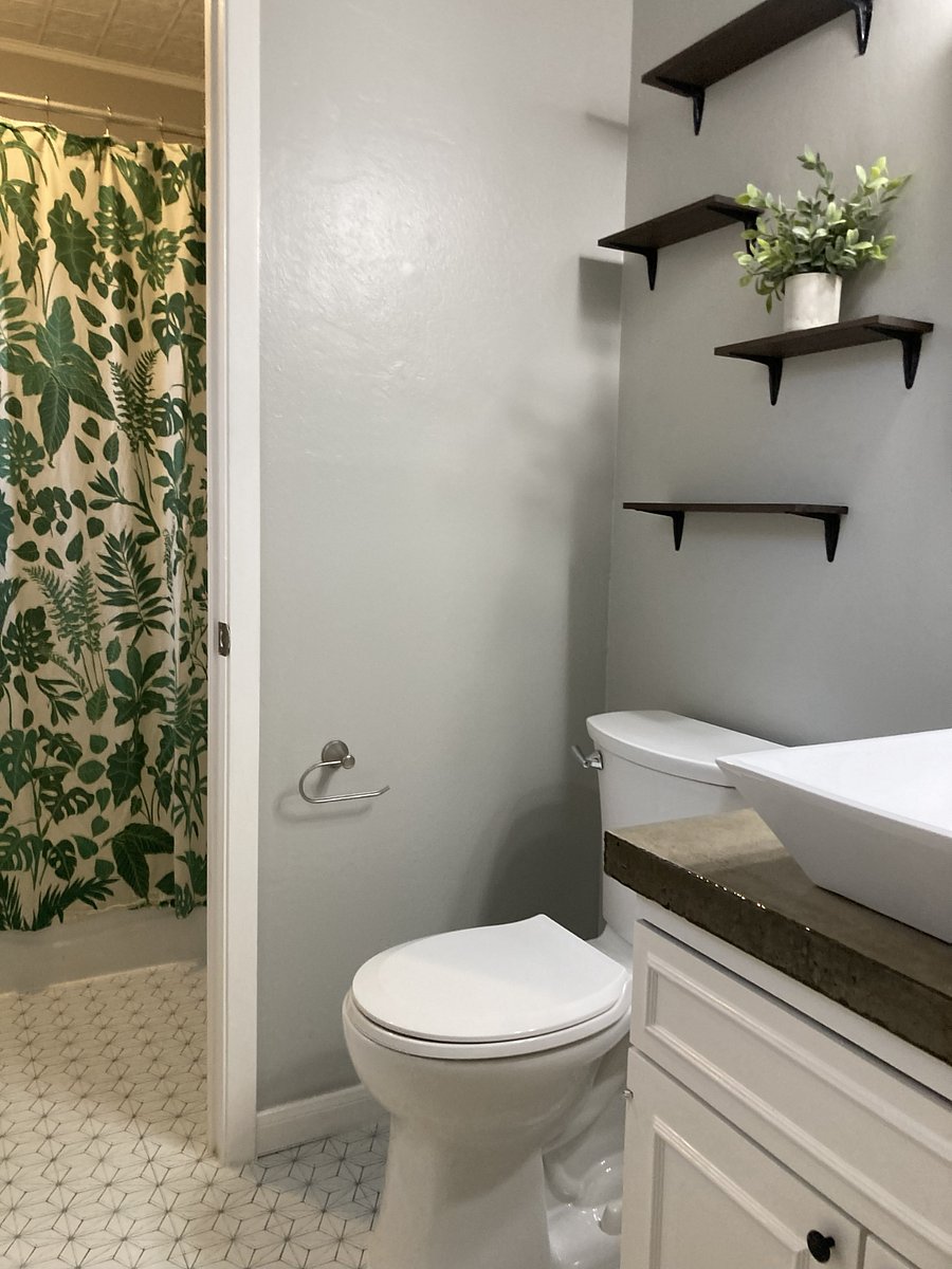 Private bathroom for bedroom #1 with door to shower room.