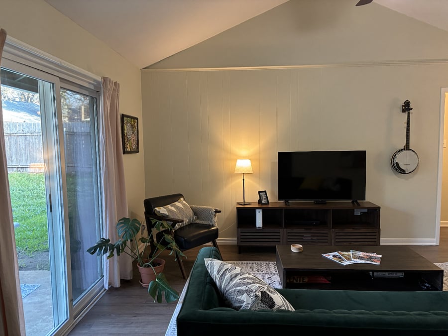 Living room, lots of natural light. Smart TV with sound bar