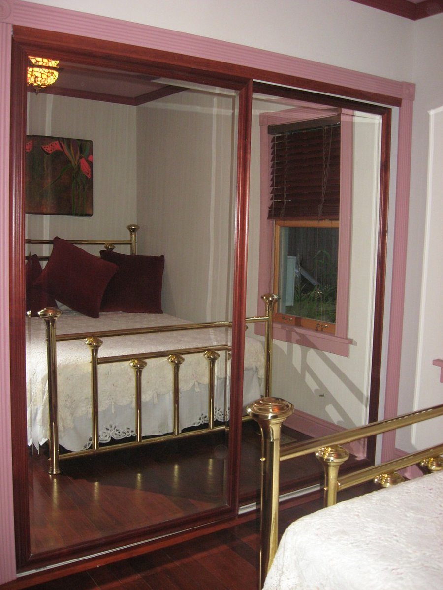 Mirrored closet in main bedroom