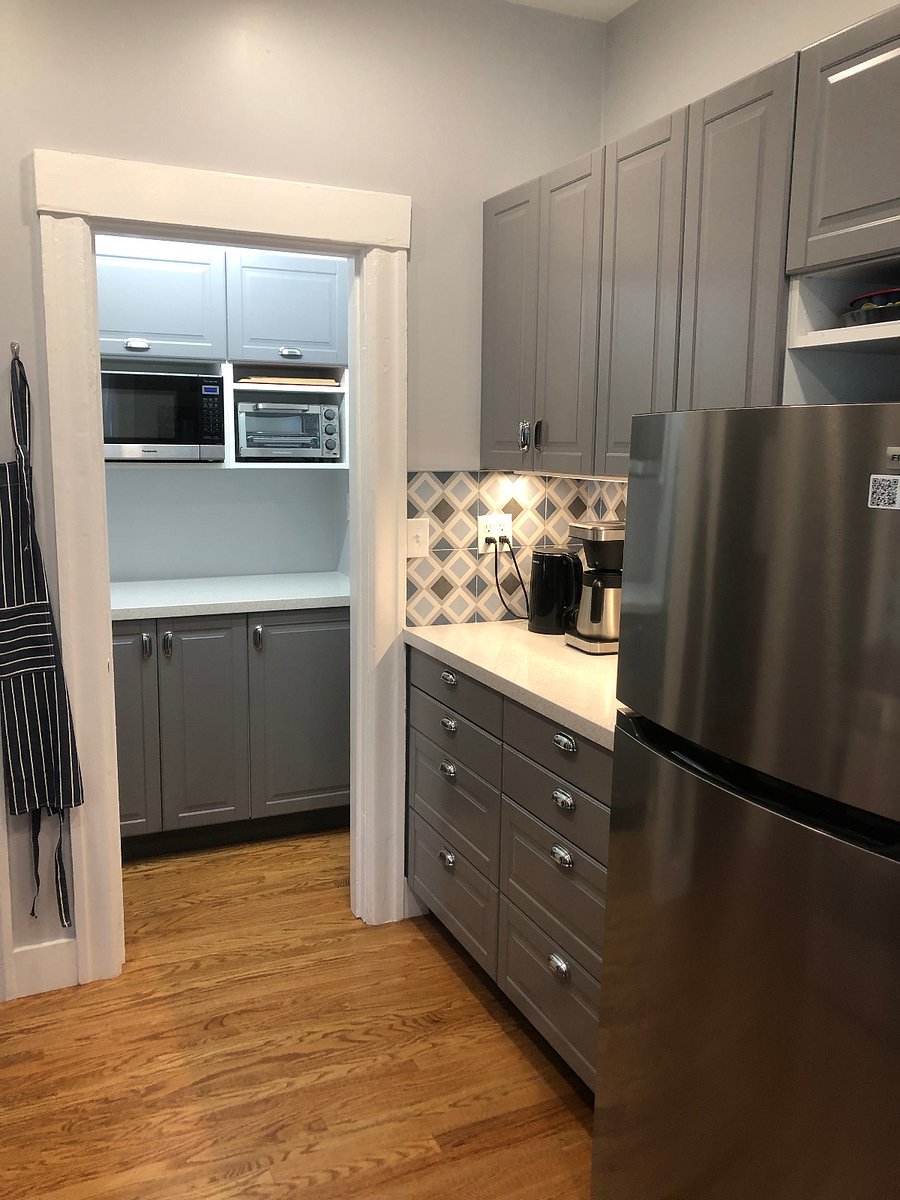 Kitchen includes pantry with microwave and toaster and extra storage