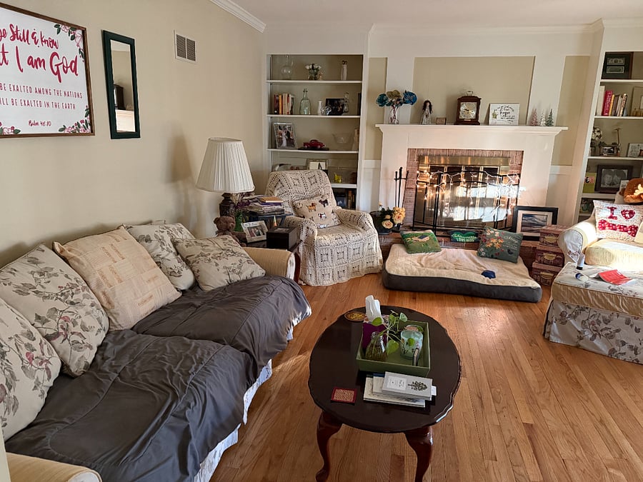 Family room with fireplace & pretty lights