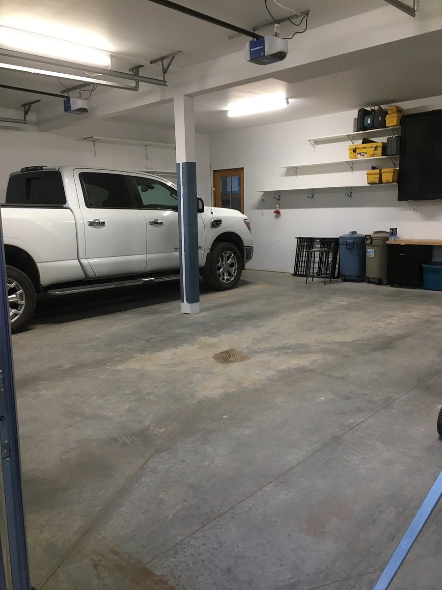 Parking space in clean, heated garage. Lots of shelves and cabinet storage in the garage. 