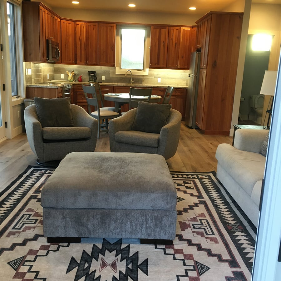 Living room/dining area. Dining table is expandable with additional leaves. 
