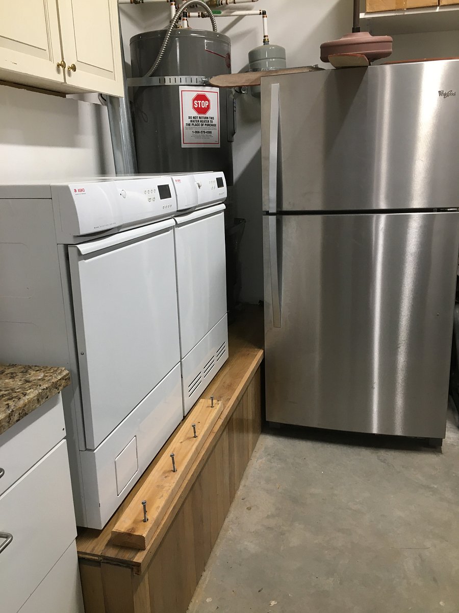Utility sink, washer, dryer, and additional refrigerator w/freezer for tenants use. 