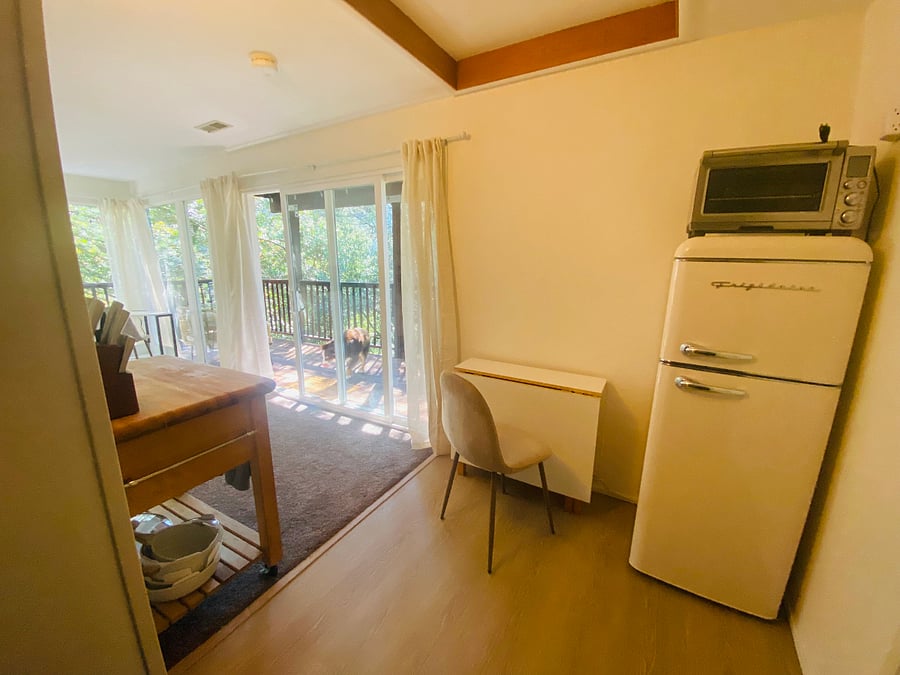 Fridge, toaster oven, and expandable dining table. 