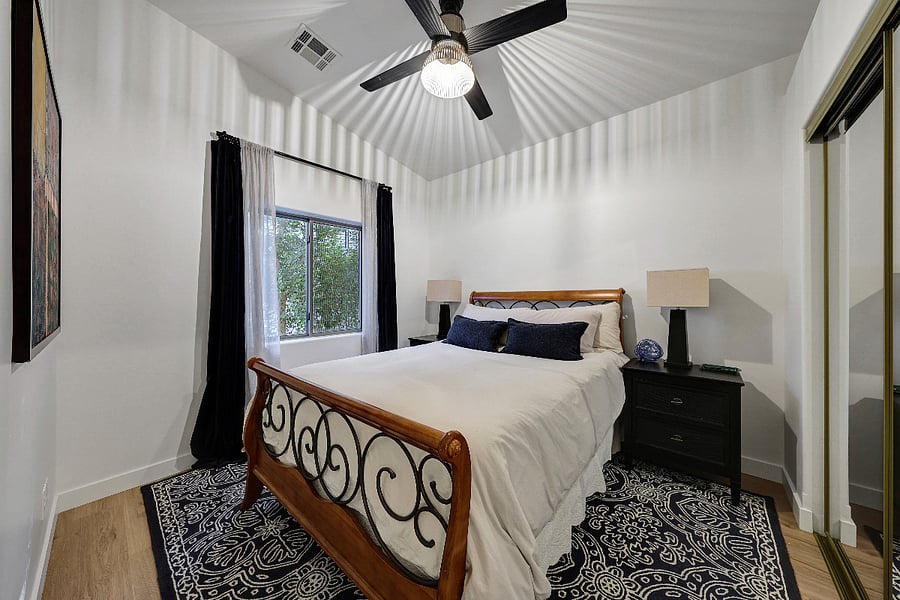 The guest room includes a queen bed.