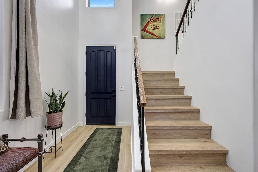 Entryway features vaulted ceilings, creating an airy and open feel.