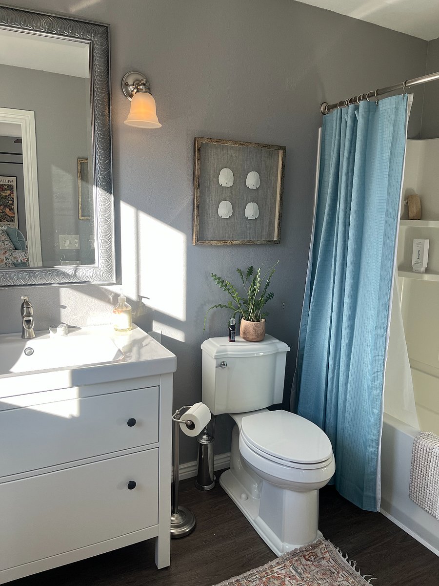 Roomy and stylish bathroom with tub and shower.