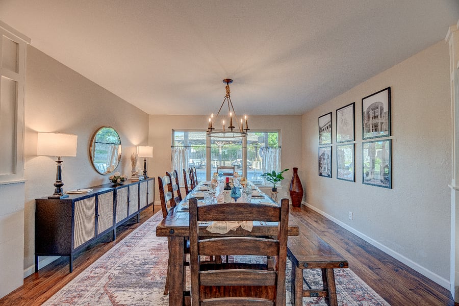 Large dining table with plenty of seating  perfect for meals, projects, or visiting family.