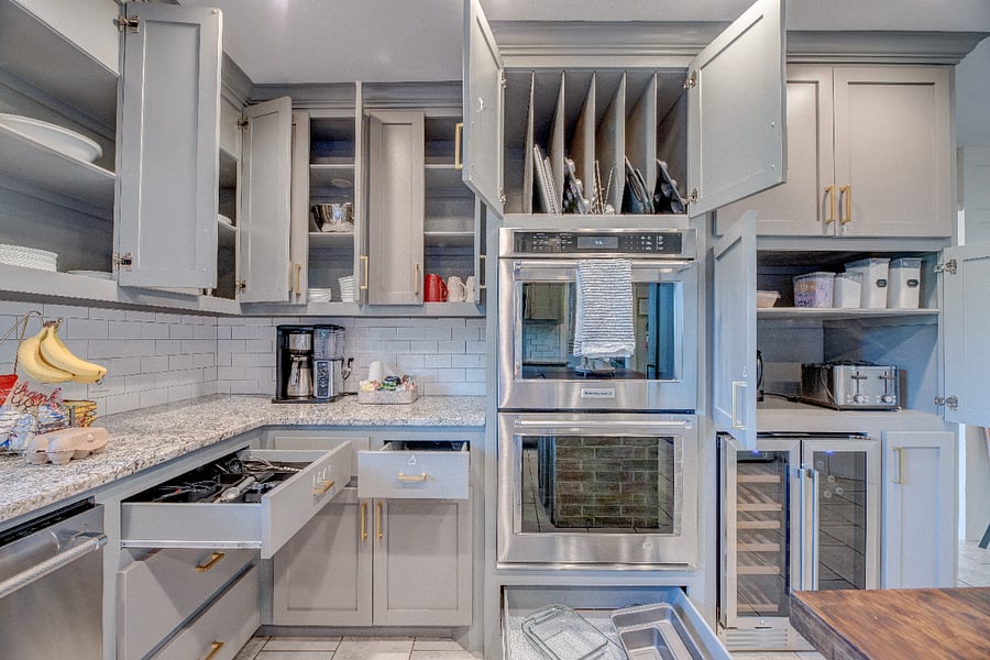 The kitchen features double ovens, drink/ wine fridge, and all your cooking essentials. 