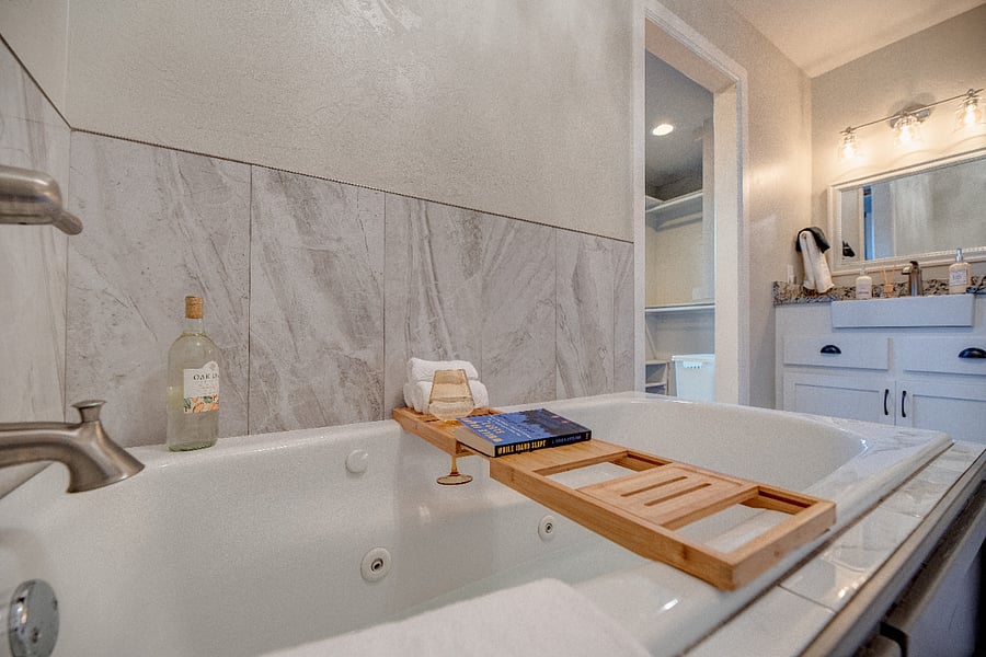 Deep jetted tub for a spa-like experience at home.