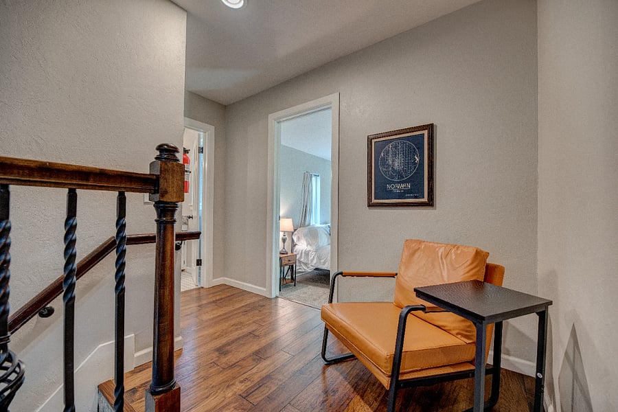 Cozy landing area with natural light  great for reading or a quiet moment.
