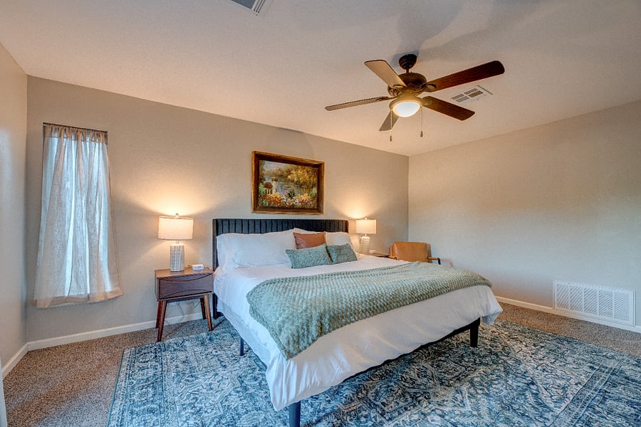 The upstiars primary suite features a king bed, ensuite bath with walk-in shower, and your own private deck. 