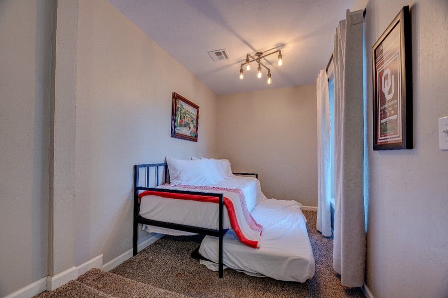 Cozy nook with kids trundle bed  perfect for visiting family or extra sleeping space.