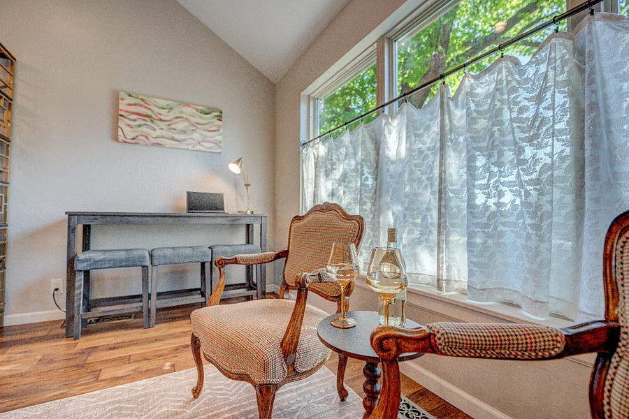 The living room also features a work space and additonal seating area to unwiind and relax. 
