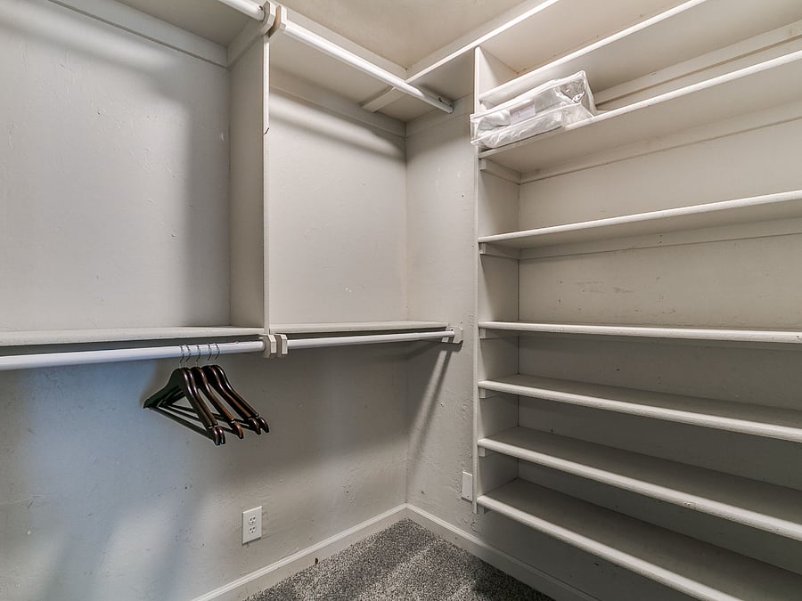 One of two huge walk-in closet with ample shelving for long-term stays in the downstairs priamry suite. 