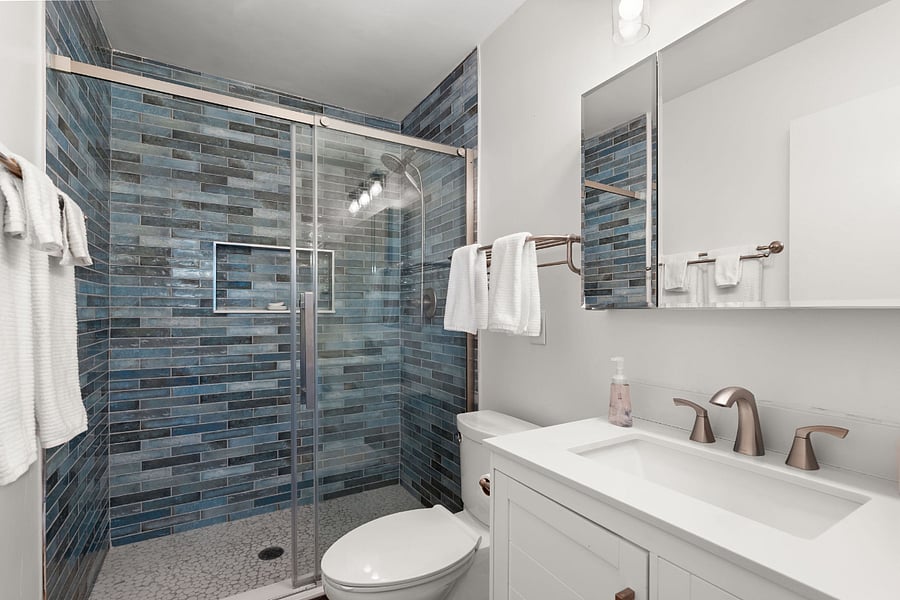 Full bathroom with walk-in shower. 