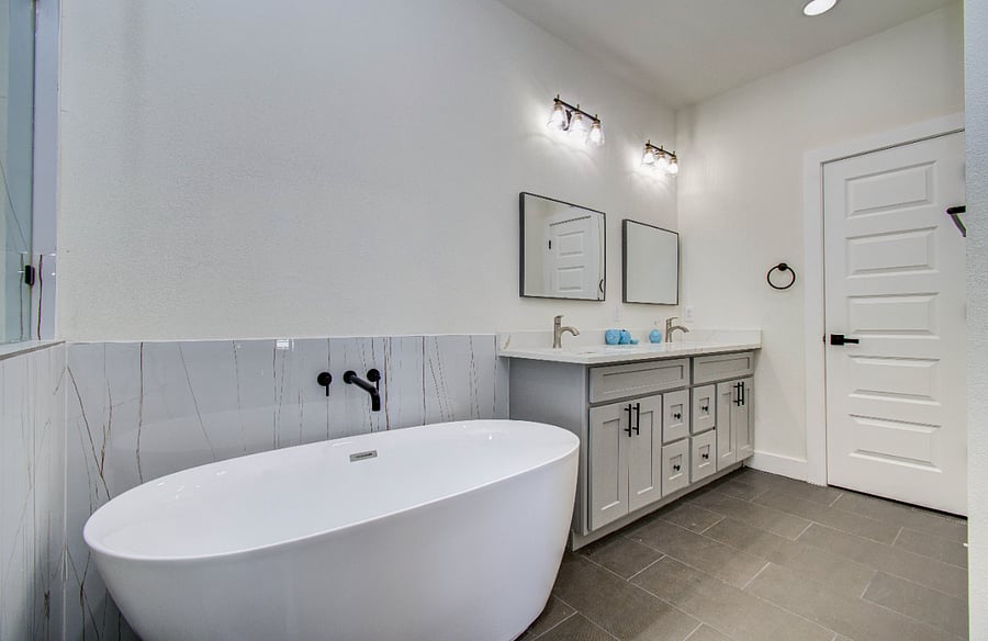 Ensuite bathroom with double vanity with quartz countertop
