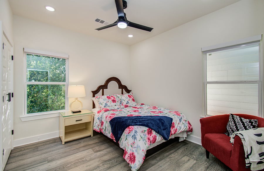 Guest bedroom with queen bed and  ensuite closet