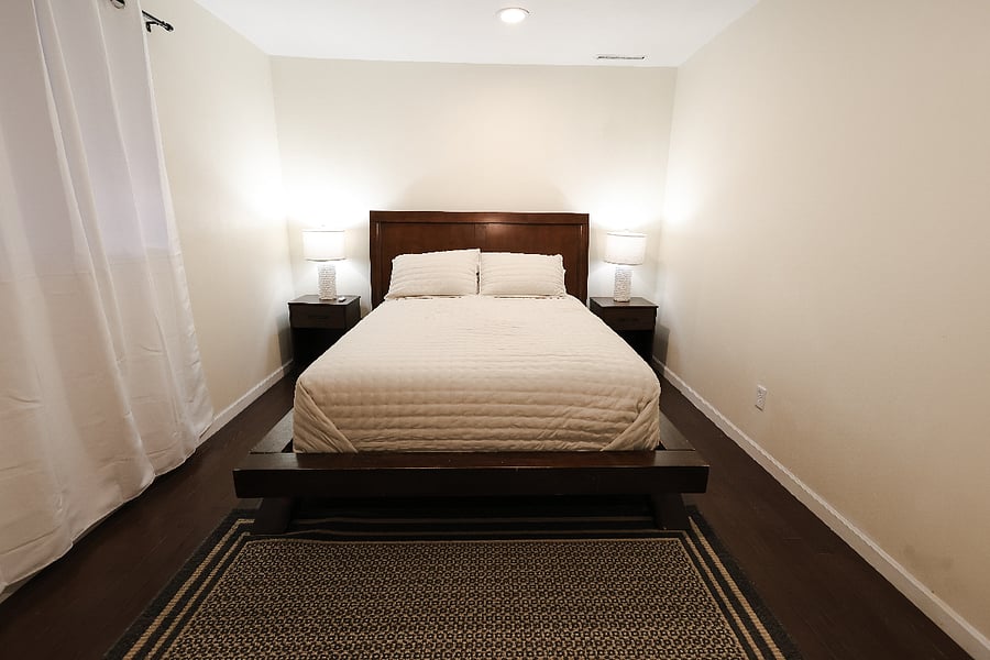 Lower level private bedroom with queen bed and, walk-in closet.