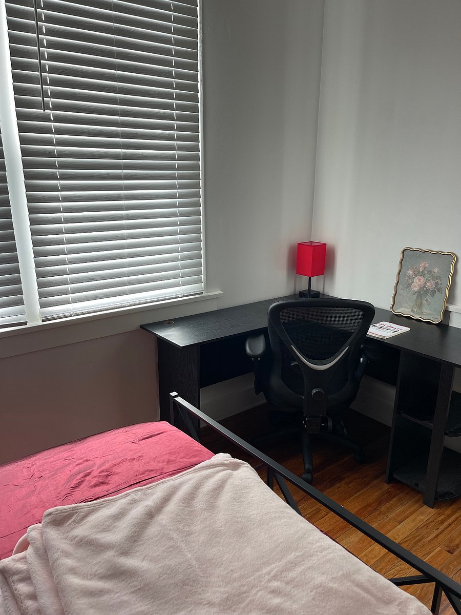 corner desk + office chair as dedicated workspace area in bedroom
