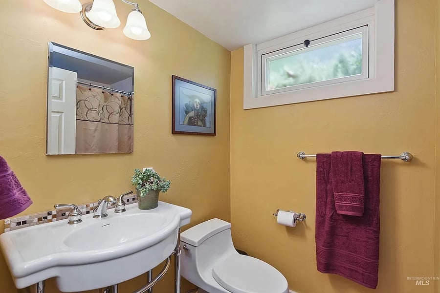 Downstairs bathroom with bathtub and shower