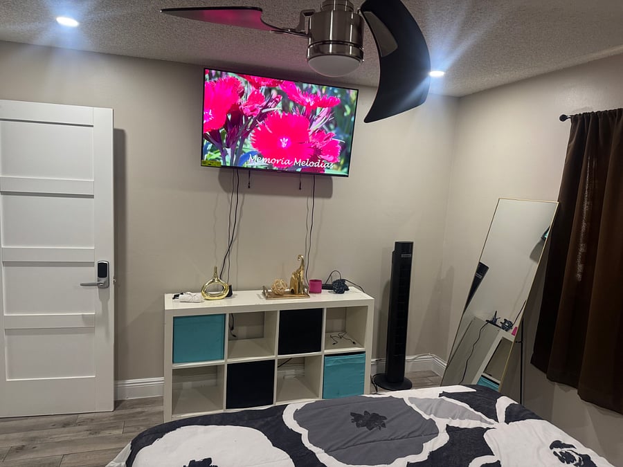 The room includes a modern smart TV with all the top streaming apps and features, plus a side mirror so you can easily check your look before heading out.