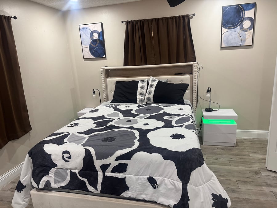 The headboard includes USB ports so you can charge your phone easily, and there's a gentle sensor light under the bed that turns on when you stand up at night.