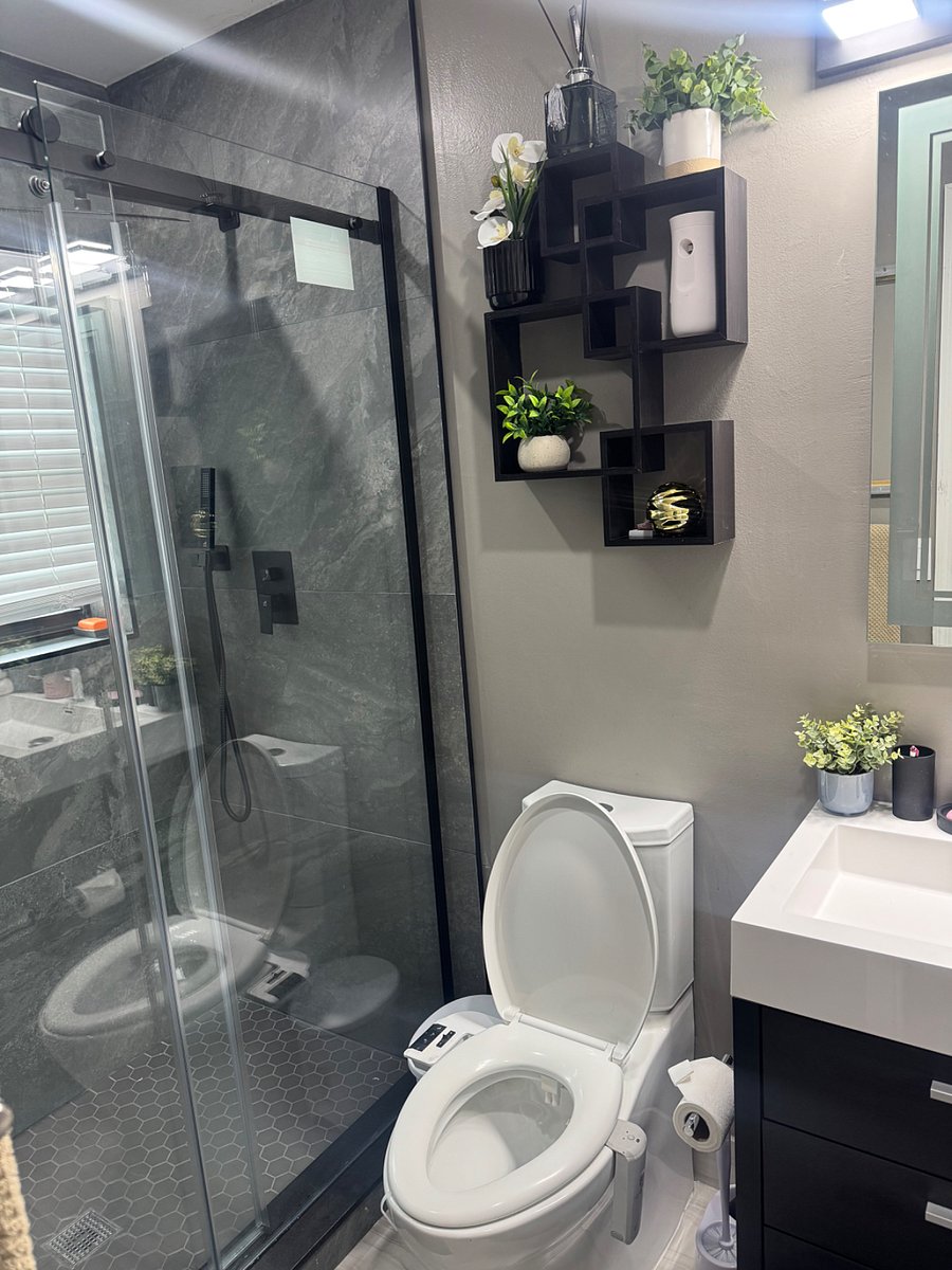 The bathroom features a modern bidet toilet with adjustable water spray for a clean, comfortable, and hygienic experience