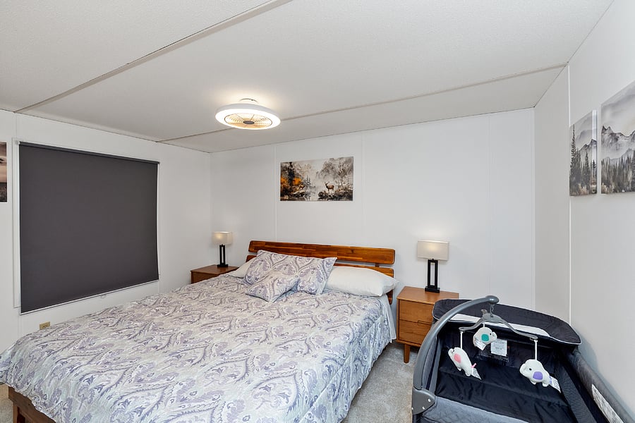 Bedroom 2 with king bed and baby crib 