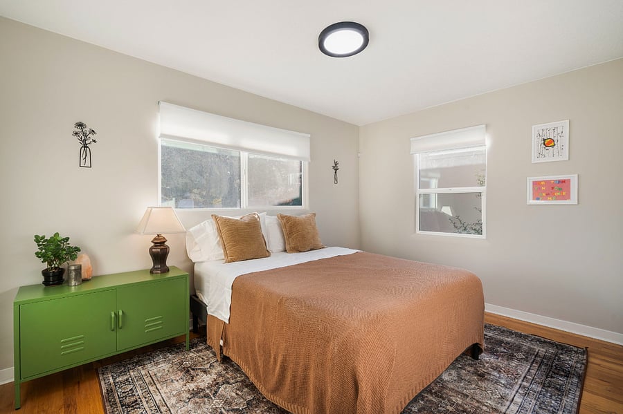 Private queen bedroom with storage and TV, just regular blinds, not blackout.