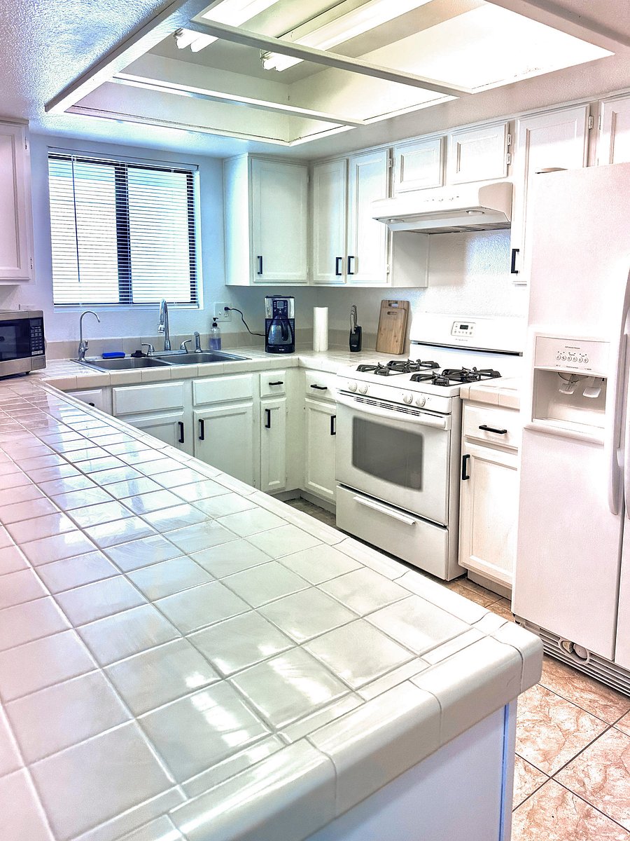Full kitchen, full fridge, coffee maker, microwave, gas stove, oven, and basic utensils and kitchen ware.