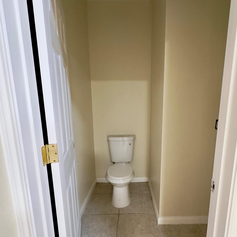 HALF BATHROOM TOILET SEAT DOWN STAIRS.
