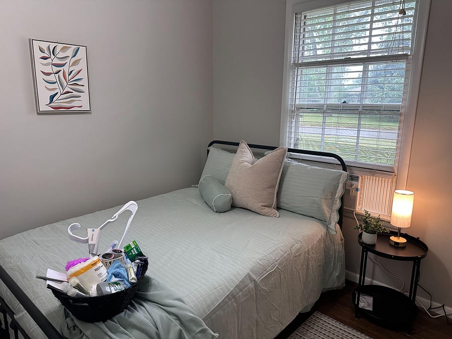 Modern room with memory foam bed, touch light, closet, and smart lock.