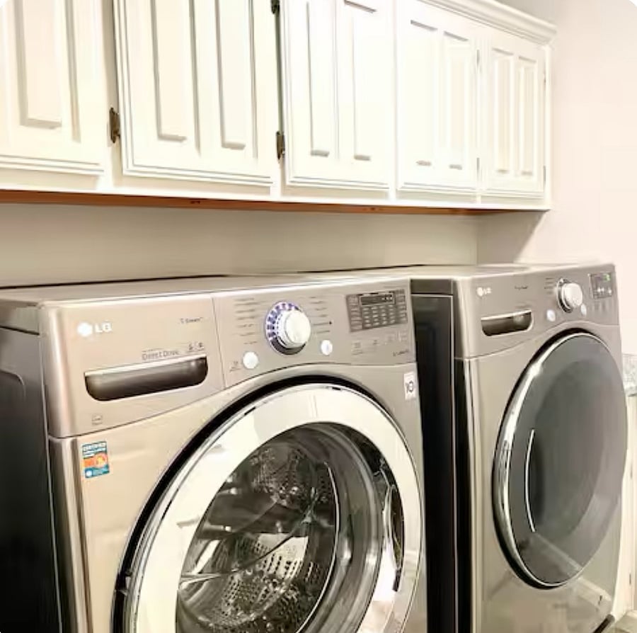 Full sized washer/dryer in dedicated laundry room.