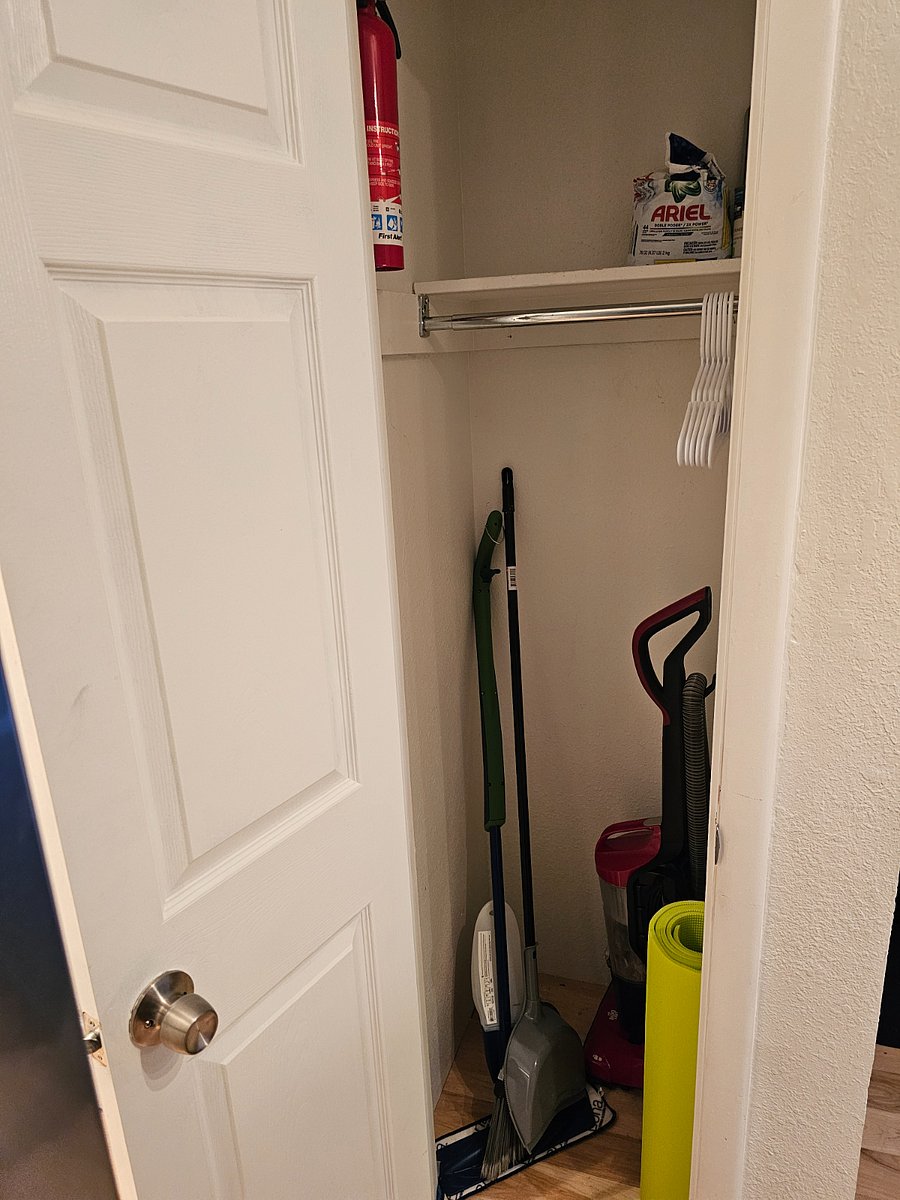storage closest in the hallway before entering bedroom