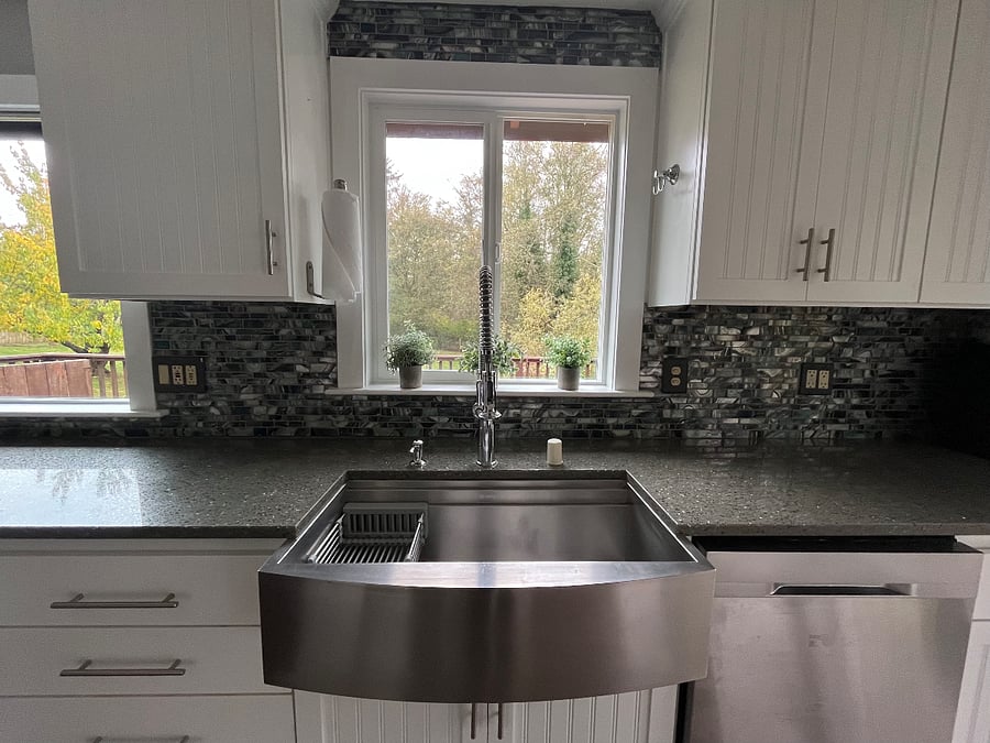 Kitchen sink with view of backyard