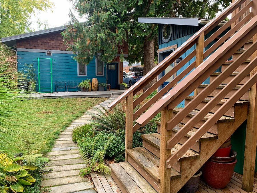 the backstairs, with a view of the backyard and cottage the owners occupy