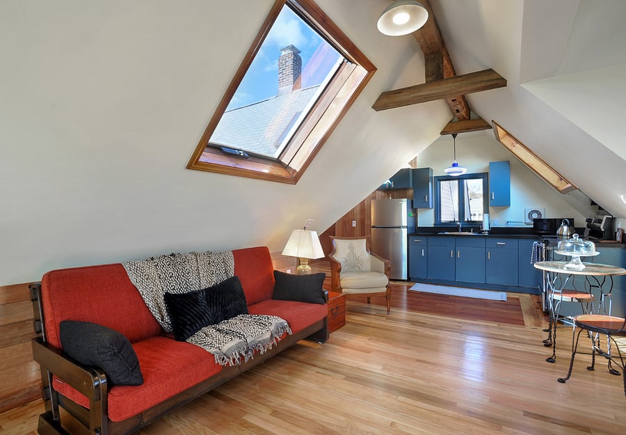 living room with operable skylights 1800 exposed beams and hardwood floor