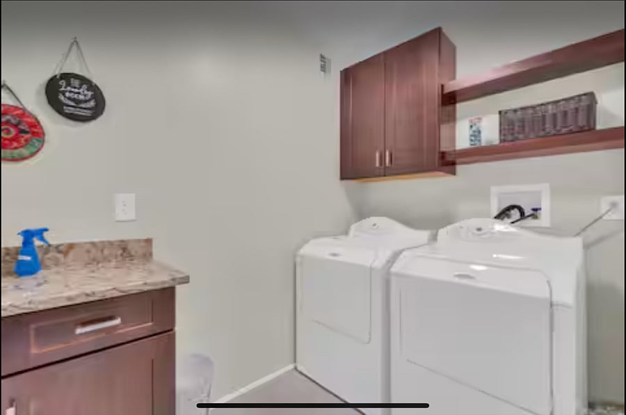 Laundry area with folding table and storage