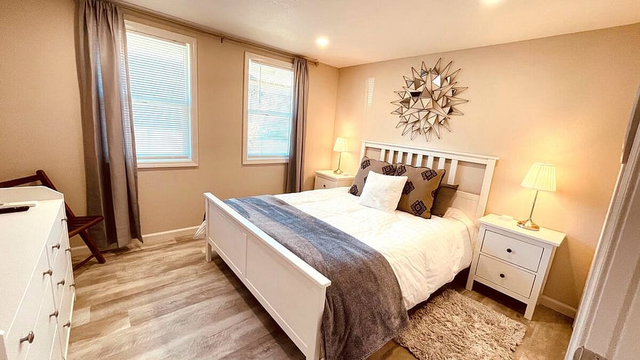 The Second Bedroom holds a comfortable, cozy Queen Bed with luxury linens, a full-size closet, chest of drawers, and Smart TV.