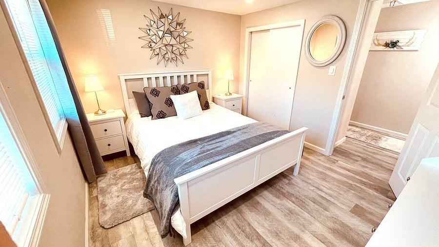 The Second Bedroom holds a comfortable, cozy Queen Bed with luxury linens, a full-size closet, chest of drawers, and Smart TV.