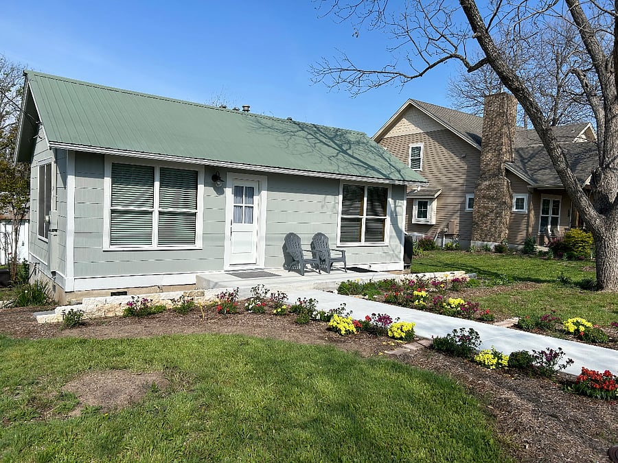 Front door entryway with a large sitting area facing east