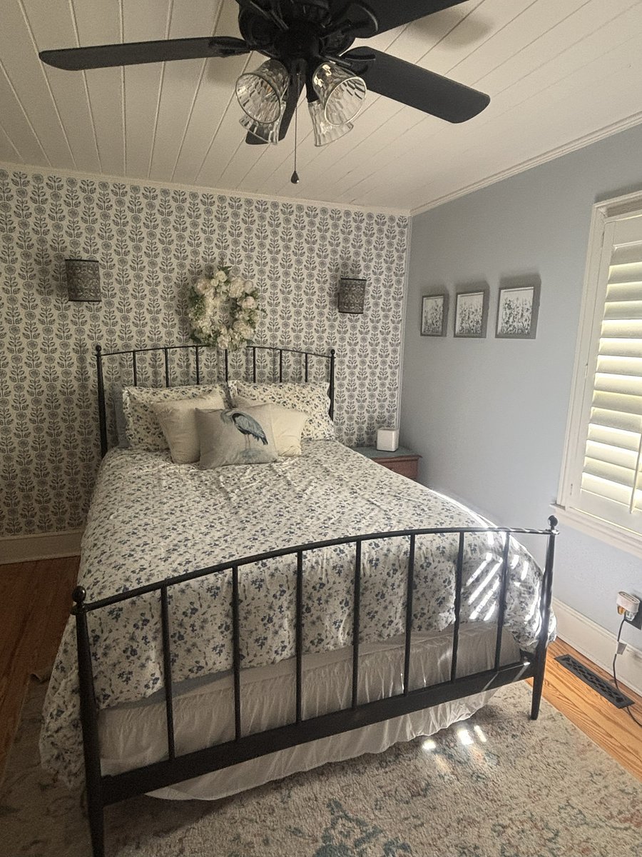 The master bedroom features a queen size bed, closet with organizers, and shutters to keep it dark and cozy for a good night's rest.