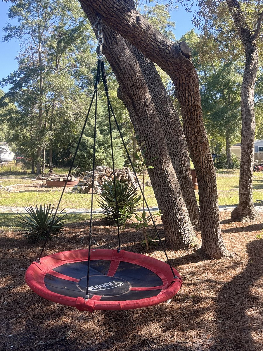 The back of the property is made for fun, including a large fire pit with chairs for enjoying a fire under the stars.