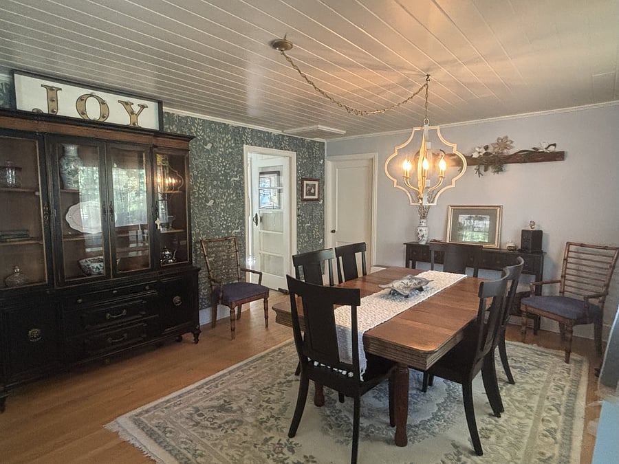 The front of the house has a large spacious dining room that easily accommodates 6-8 for meals, crafts, cards, and puzzles.