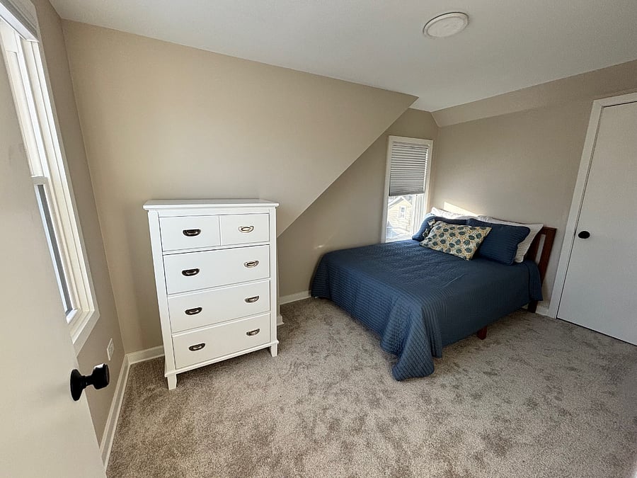 The second bedroom (full size bed) also boasts 2 windows and a large closet.